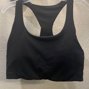 Lululemon black sport bra. Size 4 with tag. Excellent condition. Like new.